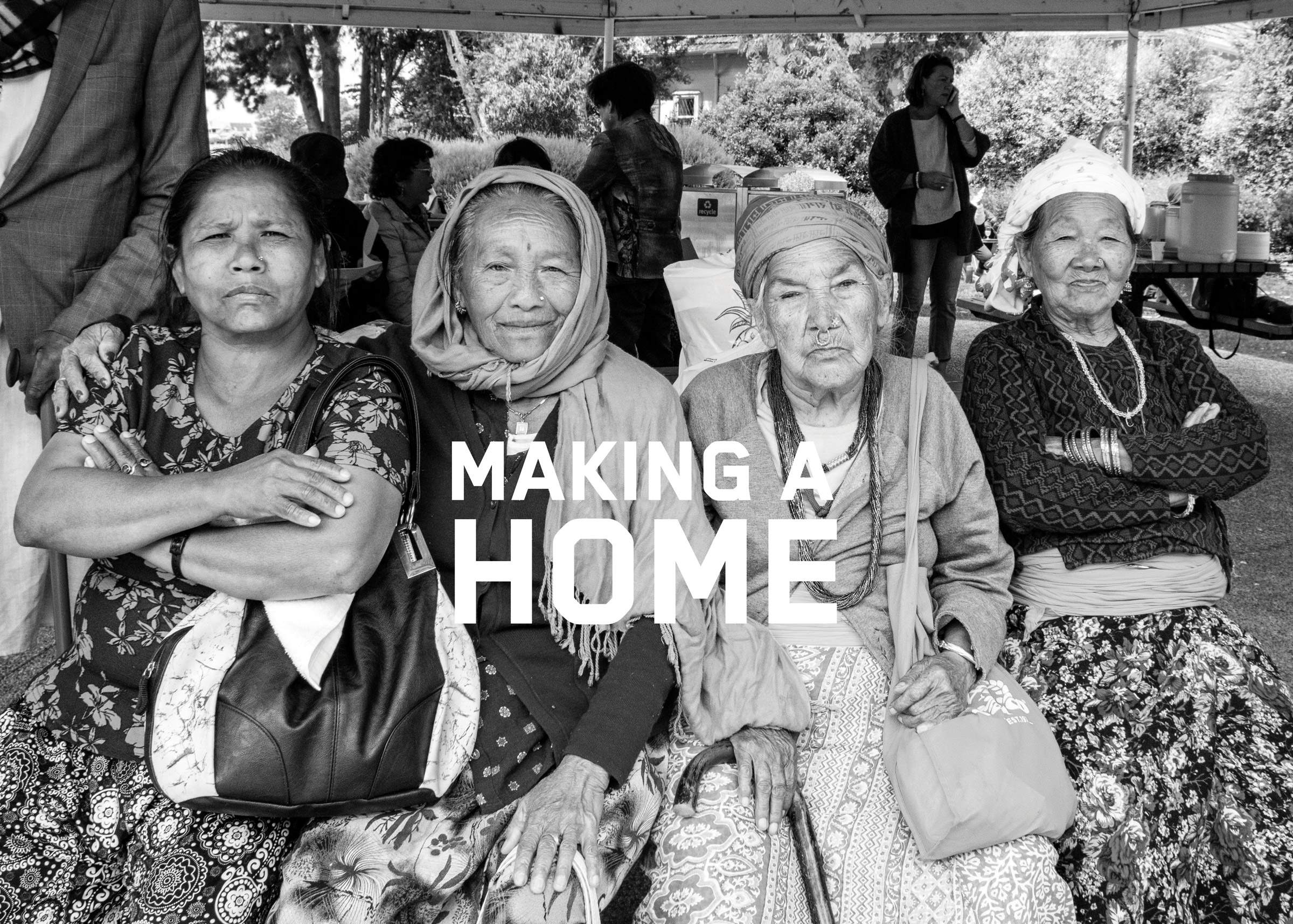 Four women sitting in a row. Image is overlaid with white text reading 'MAKING A HOME'.