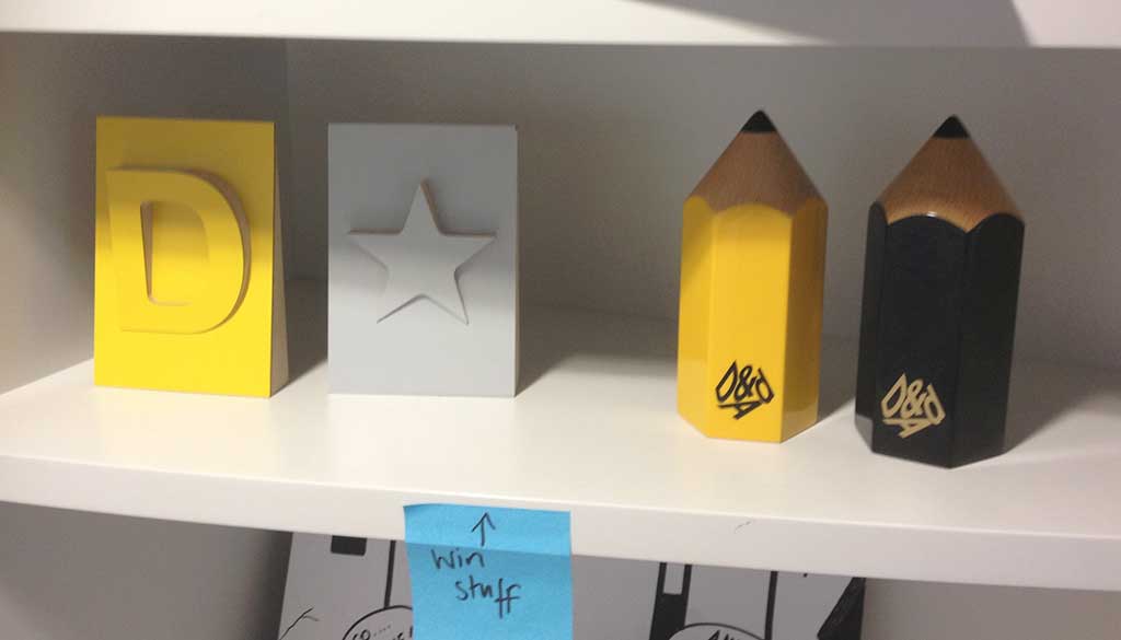 A shelf in the GDS office displaying various awards.