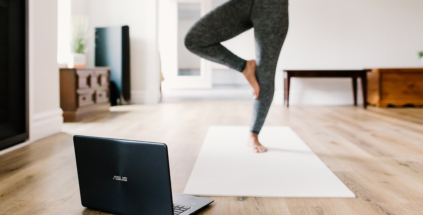 Pilates on Demand online workout session. Tree Pose on Yoga Mat.