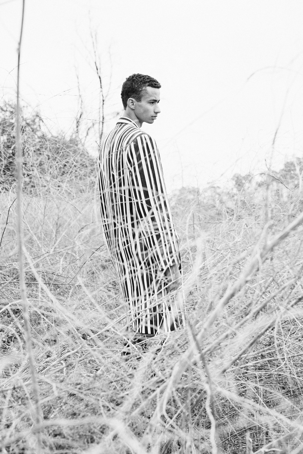 mens fashion model wearing black and white striped blazer shot by chris gonzales a los angeles based photographer