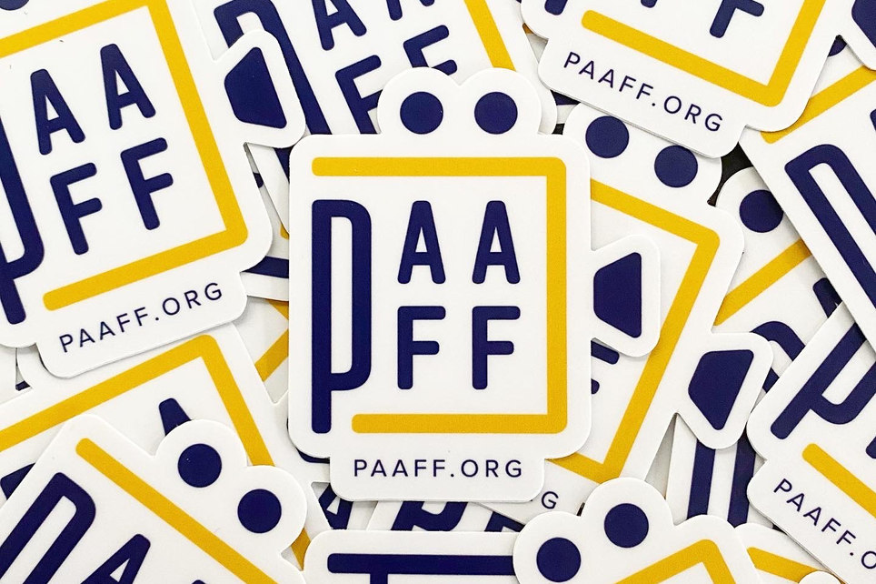 PAAFF logo stickers in a pile.
